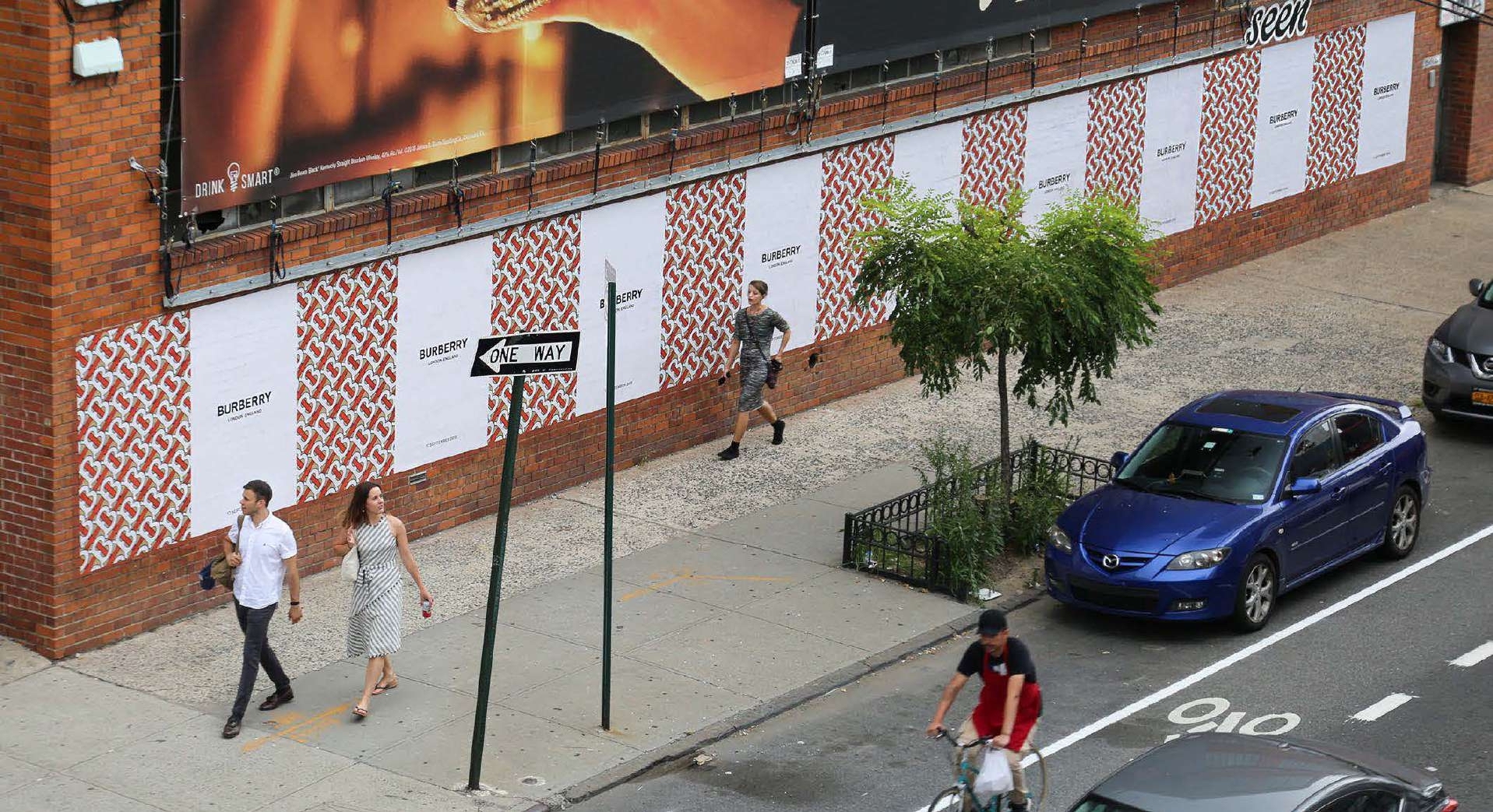 Burberry street takeover covering a brick building wall